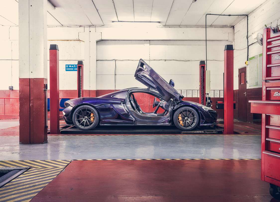 Porsche inside a vehicle storage and service facility